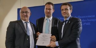 Fabrice Pesin (au centre), Michel Sapin et Emmanuel Macron